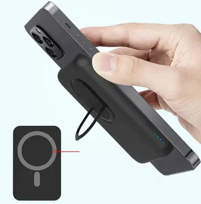 Person holding a Wireless Power Bank 5000mAh against a smartphone, showcasing fast charging capabilities.
