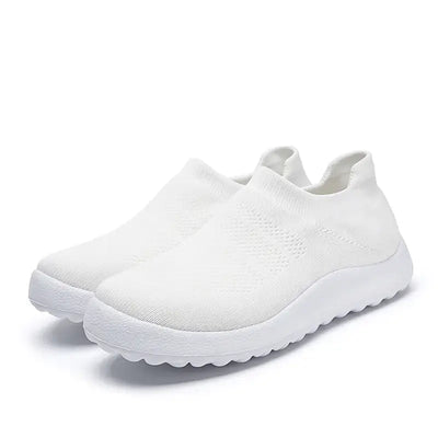 Casual Flyknit Slip-On Sneakers in white with breathable upper and flexible sole for comfort.