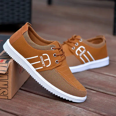 Men's breathable casual sneakers in brown with mesh details, perfect for stylish, comfortable wear.