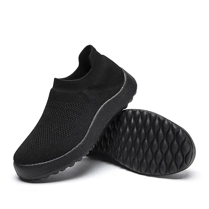 Black Casual Flyknit Slip-On Sneakers with breathable upper and textured sole for all-day comfort.