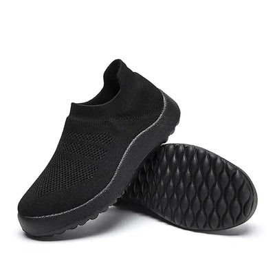 Black Casual Flyknit Slip-On Sneakers with breathable upper and textured sole for all-day comfort.