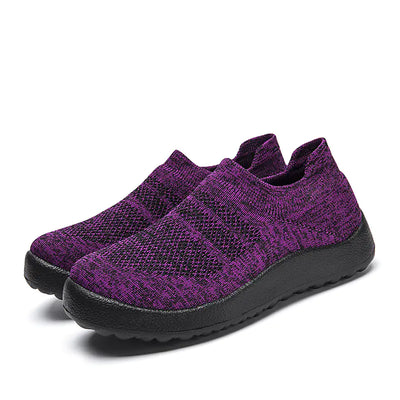 Casual Flyknit slip-on sneakers in vibrant purple with a breathable upper and comfortable black sole.