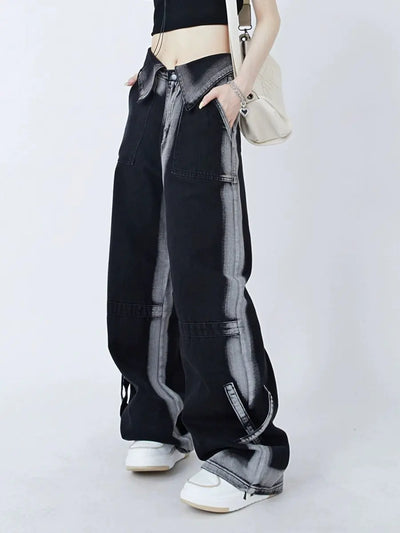 Stylish black cuffed jeans for women, featuring a relaxed fit and chic striped design, paired with sneakers.