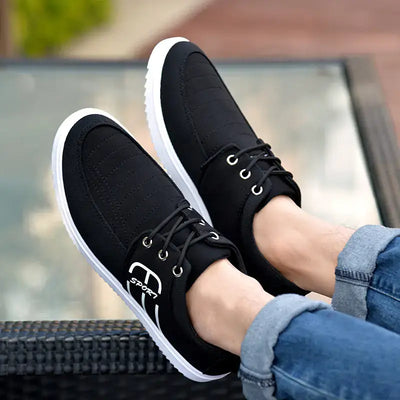 Men's breathable casual sneakers in black, featuring lace-up design and lightweight, stylish materials.