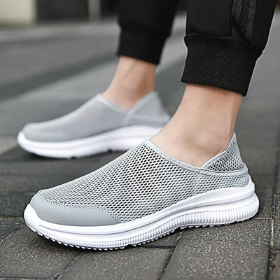 Men's slip-on breathable mesh sneakers in gray, perfect for active lifestyles and all-day comfort.