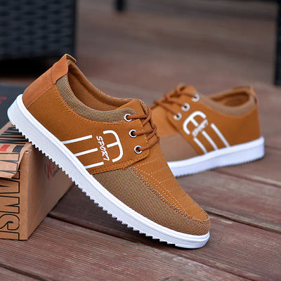 Men's breathable casual sneakers in brown with a stylish design and cushioned insole for comfort.